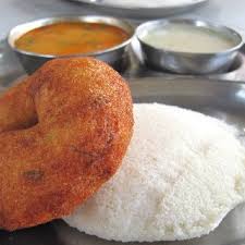 Idli and Vada are a popular and traditional breakfast combo in South India, often served with sambar & Chutneys
